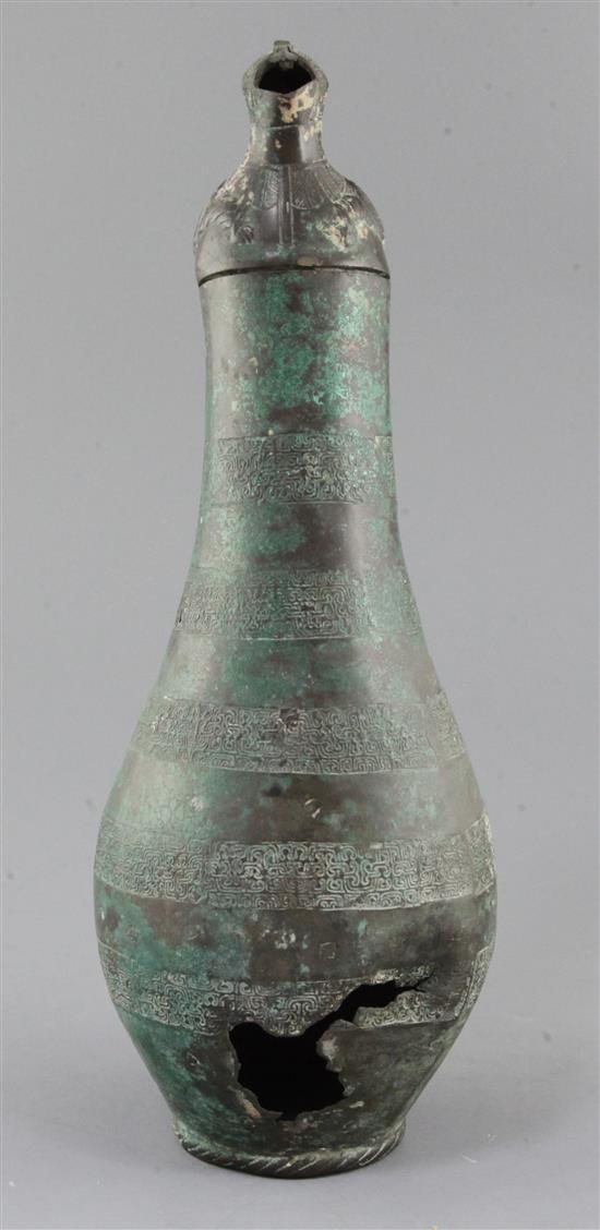 A Chinese archaic bronze flask-shaped ritual wine vessel, Hu, Eastern Zhou dynasty, 5th-4th century B.C., 36.5cm high, hole to base and